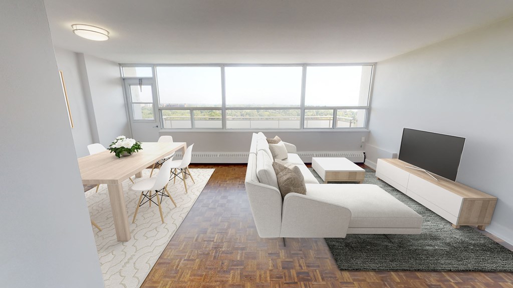 Spacious living area with natural light. Thumbnail click to zoom