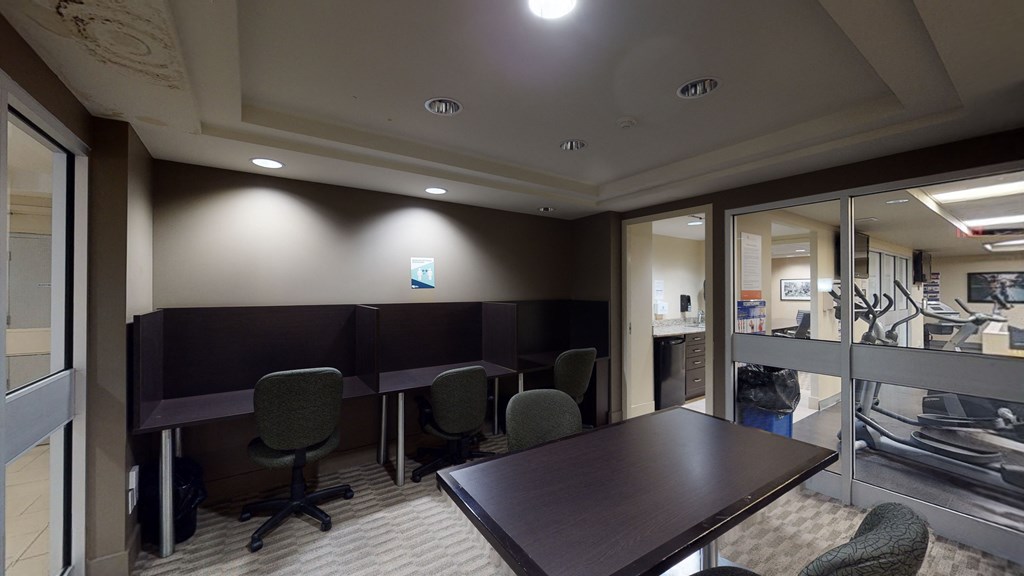 a conference room with a table and chairs