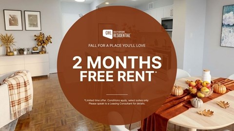 A room with a table set for a meal and a sign offering 2 months free rent.