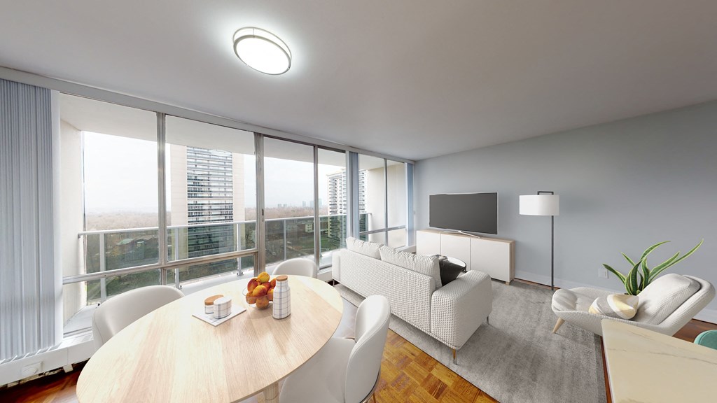 A modern living room with a large window and a flat screen TV.