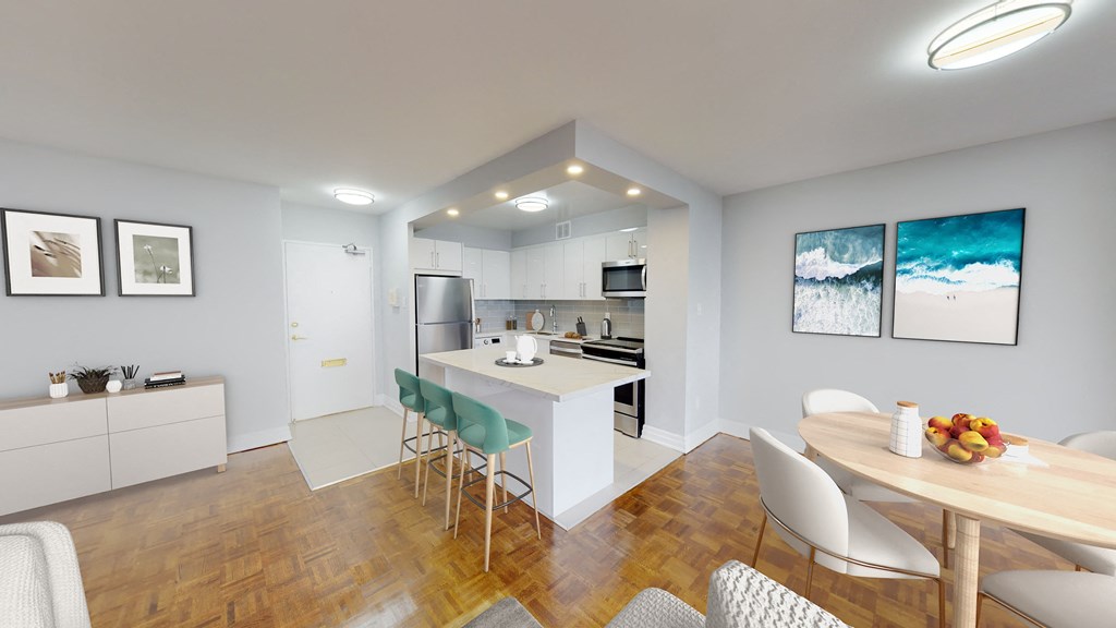 A modern kitchen with a dining table and chairs.