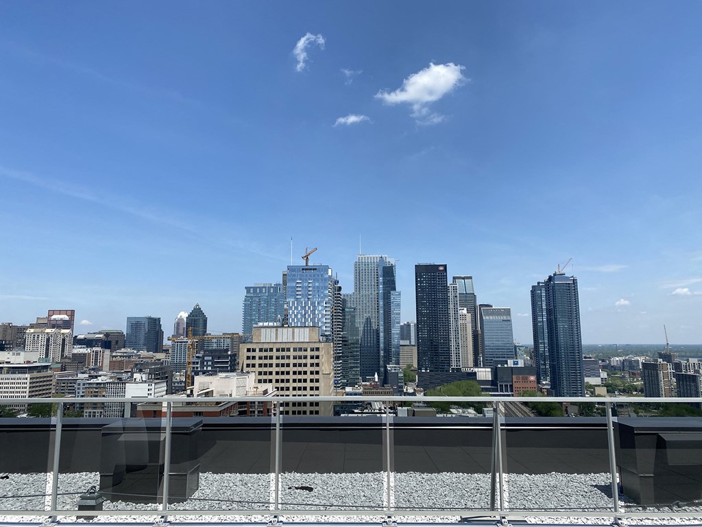 the view of the city from the roof of a building