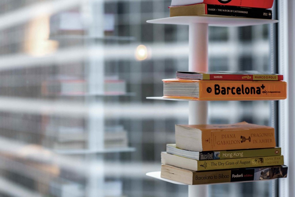A stack of books with the top one titled Barcelona.