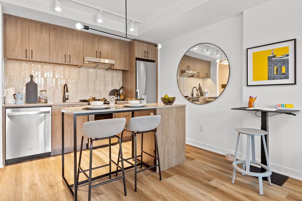 a kitchen with a breakfast bar and stools