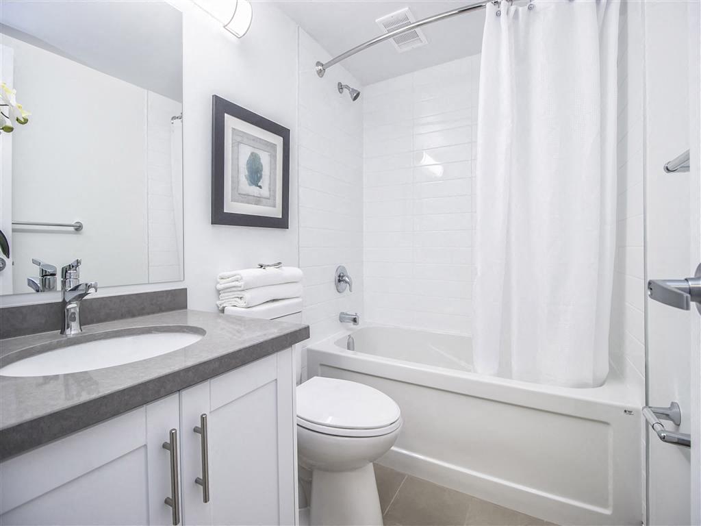 Bright and renovated bathrooms.  Thumbnail click to zoom.