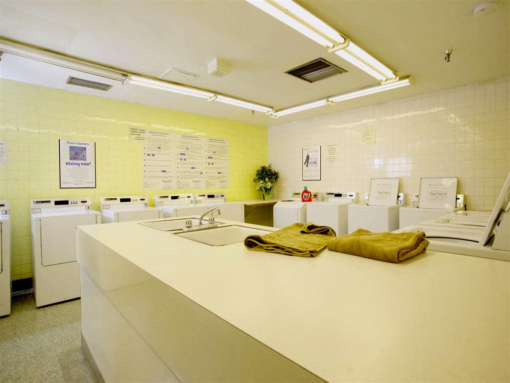 Laundry room equipped with washers and dryers.  Thumbnail click to zoom.