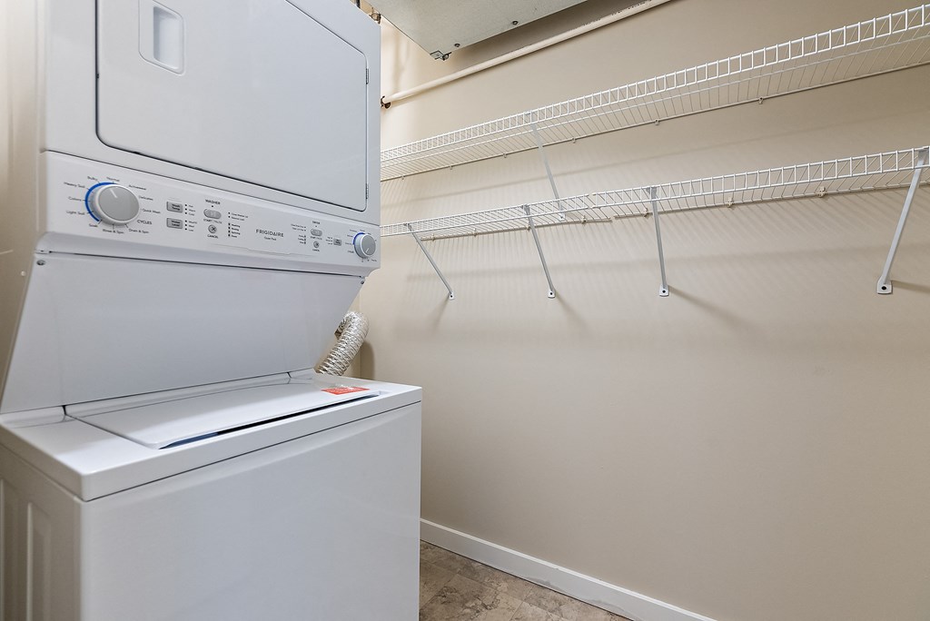 A white dryer is on the left and a white washer is on the right.