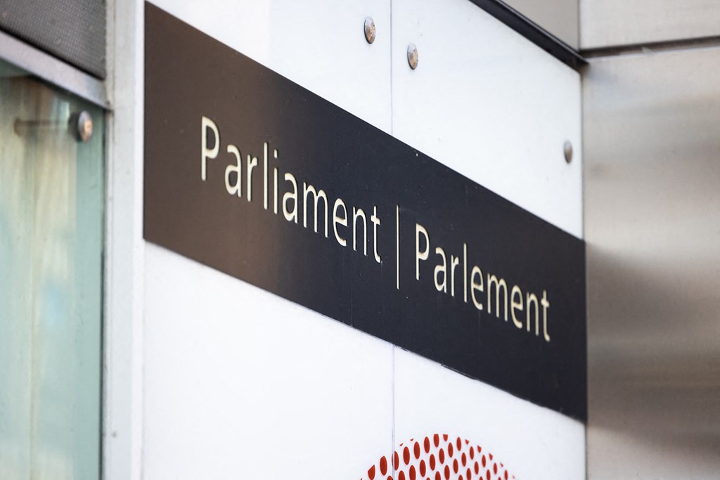 a sign on the side of a building that reads parliament parliament