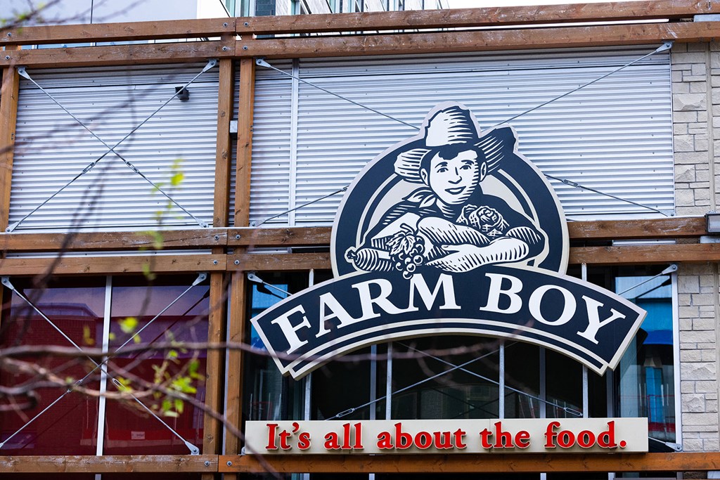 a farm boy sign on the side of a building