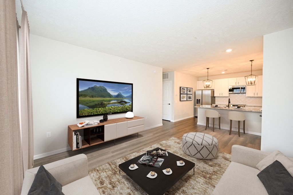 a living room with a couch and a table in front of a television at Dalton, New Albany, OH