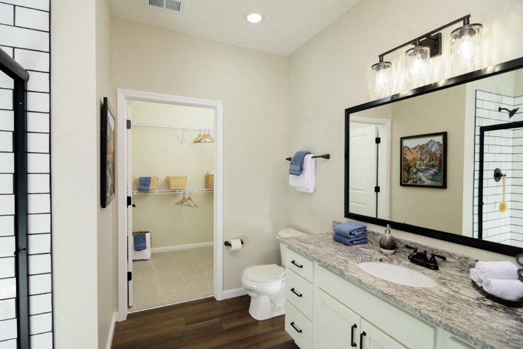 a bathroom with a sink and a mirror and a toilet at Dalton, New Albany Ohio