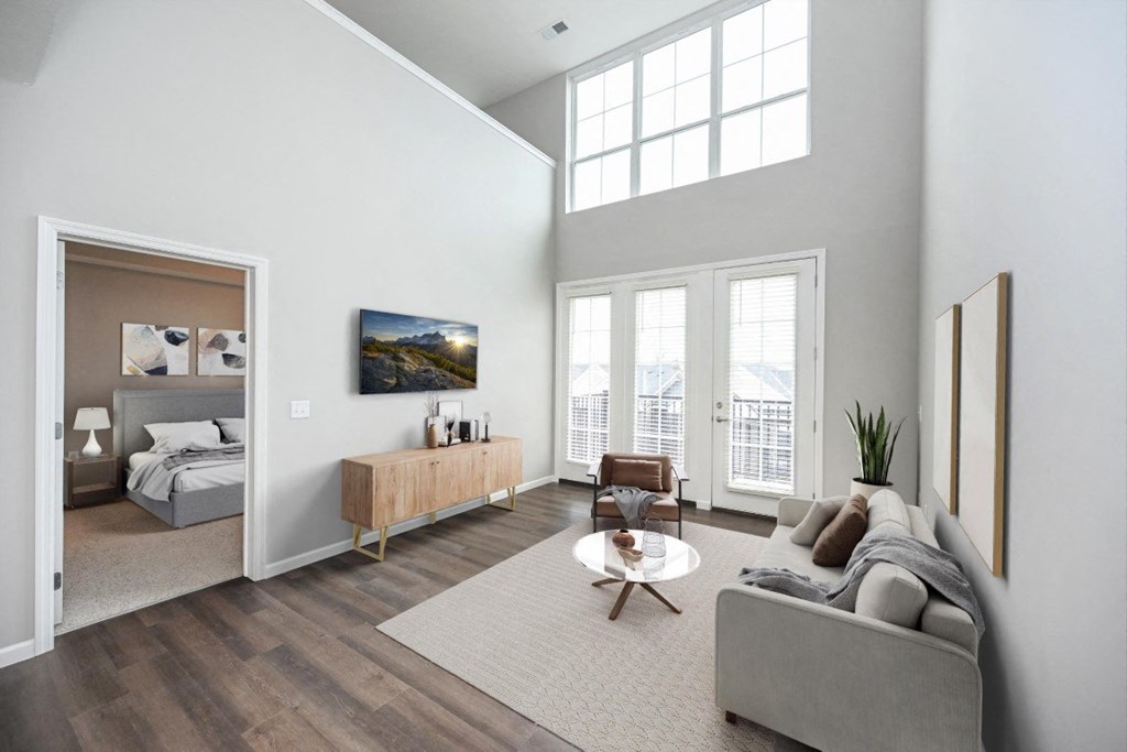 a living room with a couch and a table in front of a window at Kendall Park Too, Ohio, 43220