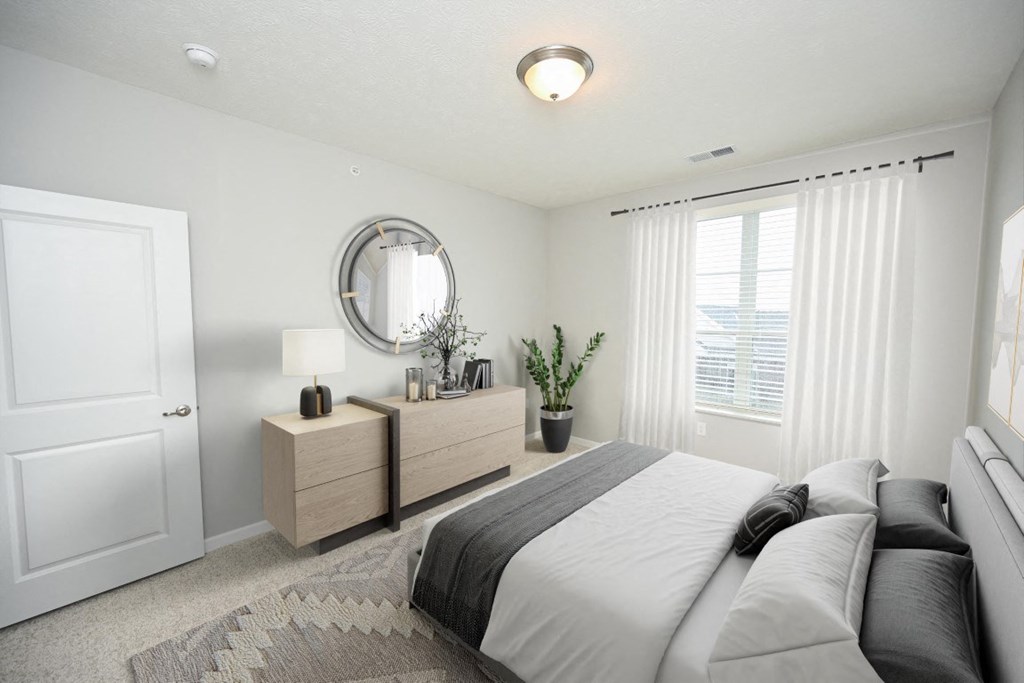 a bedroom with a bed and a mirror on the wall at Kendall Park Too, Ohio