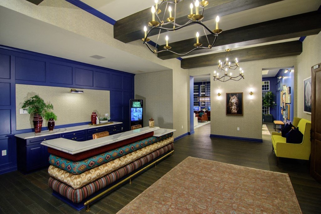 a lobby with a reception desk and a chandelier at Elan Park, Ohio