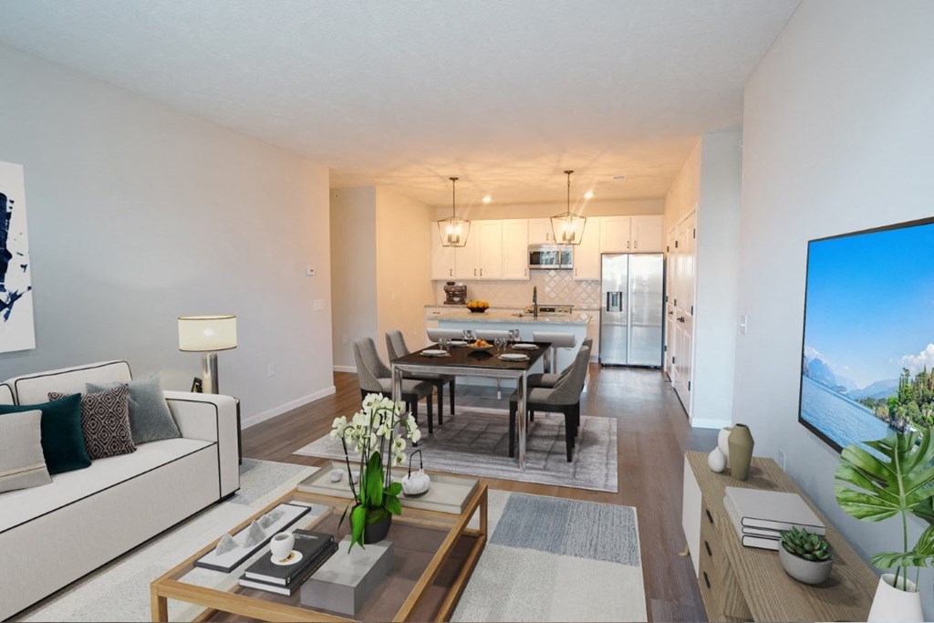 a living room and dining room with a table and chairs at Dalton, New Albany, 43081