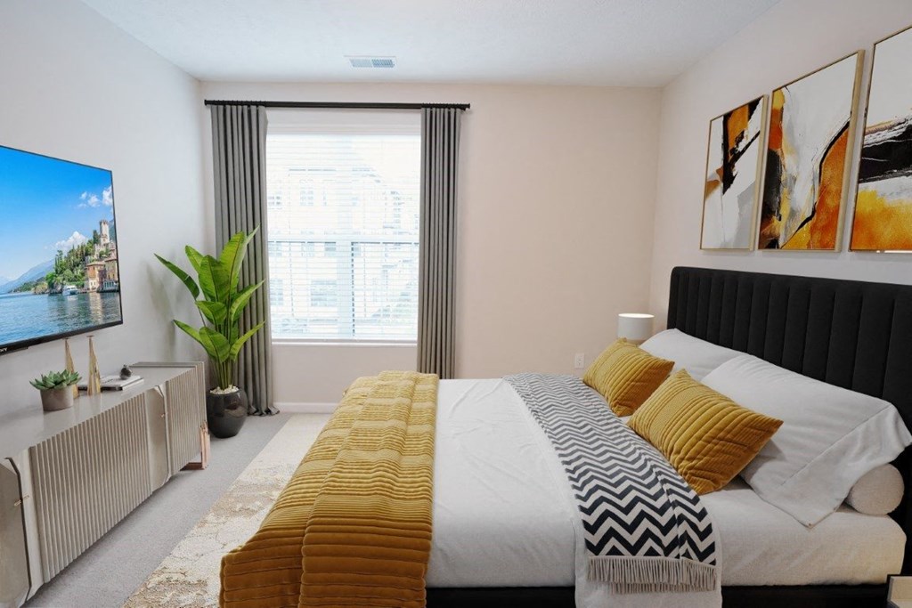 a bedroom with a bed and a large window at Dalton, New Albany, OH