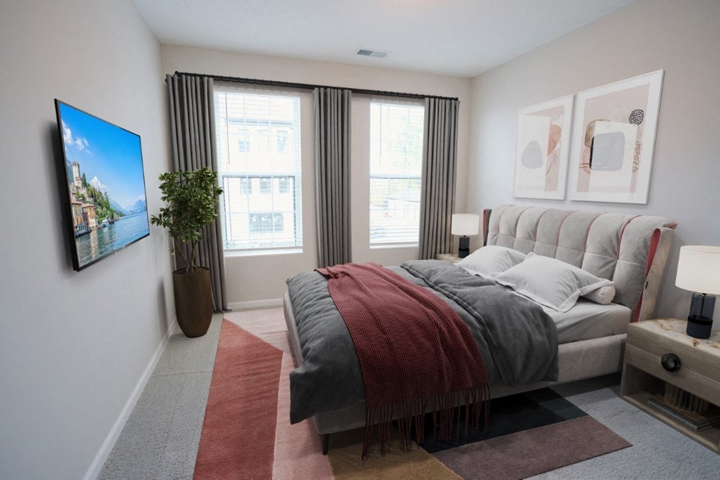 a bedroom with a bed and a tv on the wall at Dalton, New Albany, OH 43081