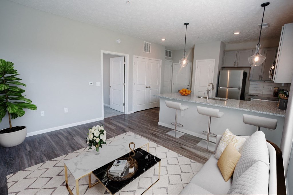 a living room and kitchen with a couch and a table at Elan Park, Ohio, 43231