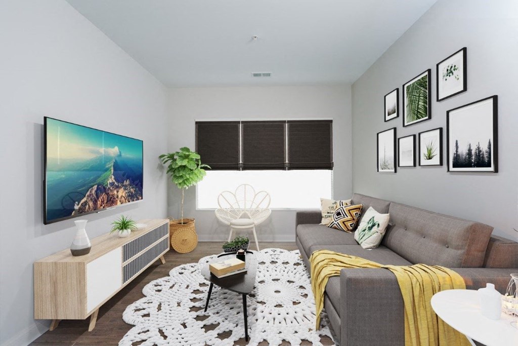 a living room with a gray couch and a yellow blanket at Fairfax, Ohio, 43212
