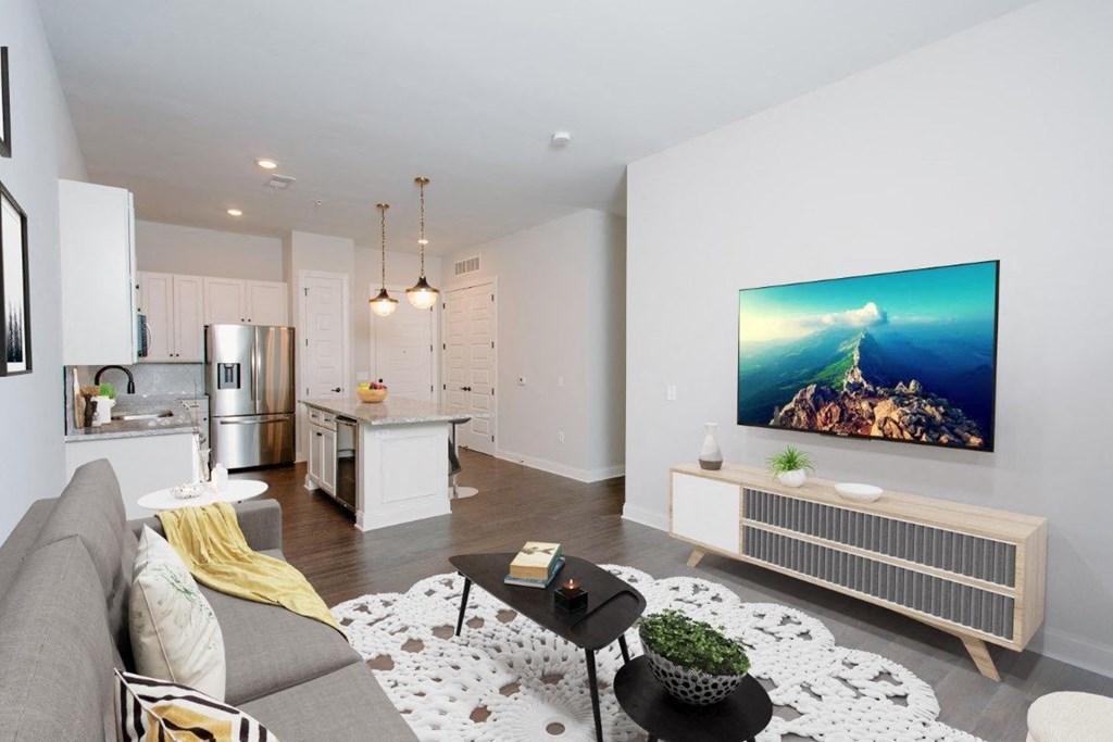 a living room with a couch and a coffee table in front of a tv at Fairfax, Grandview, OH, 43212