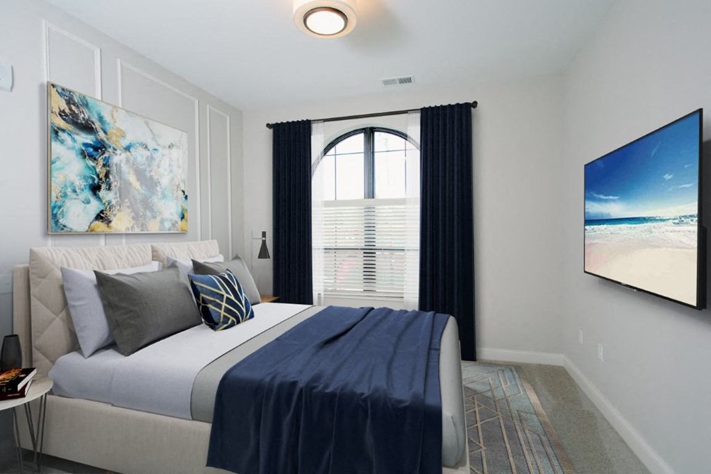 a bedroom with a large bed and a large window at Fairfax, Grandview, OH