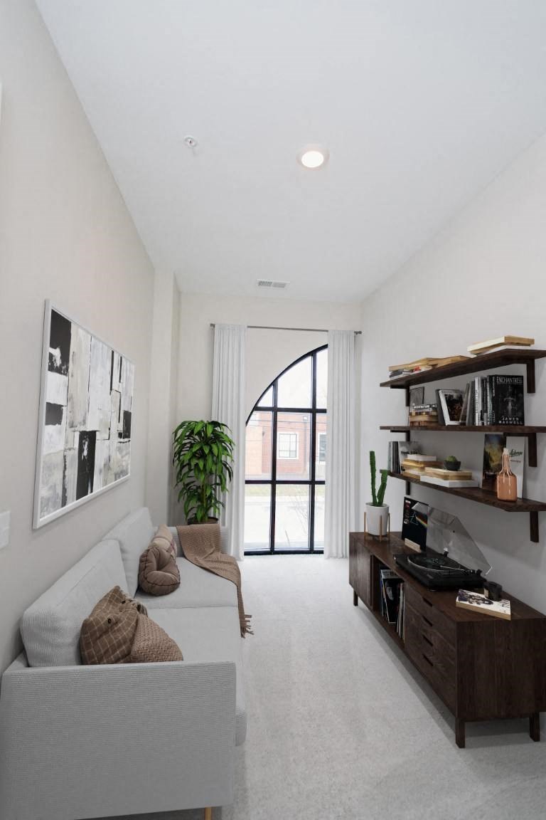 a living room with a couch and a bookshelf at Fairfax, Ohio