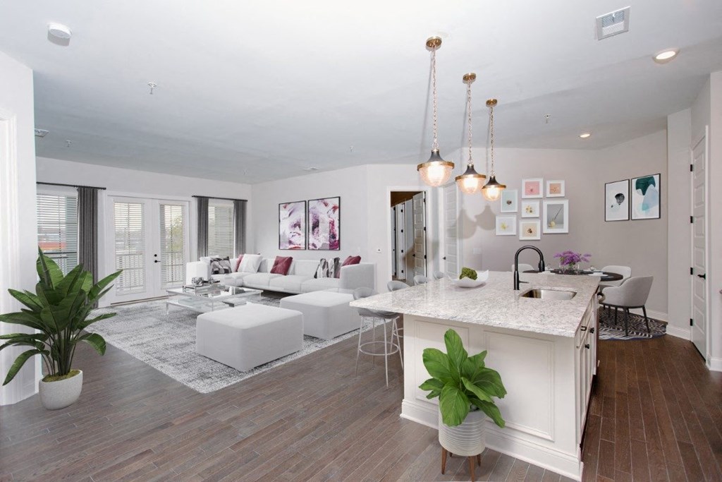 a kitchen and living room with white walls and wood floors at Fairfax, Grandview