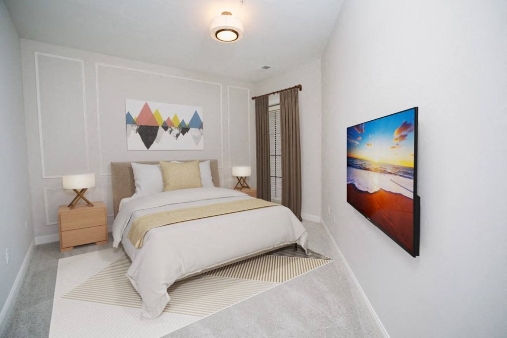 a bedroom with a bed and a painting on the wall at Fairfax, Ohio
