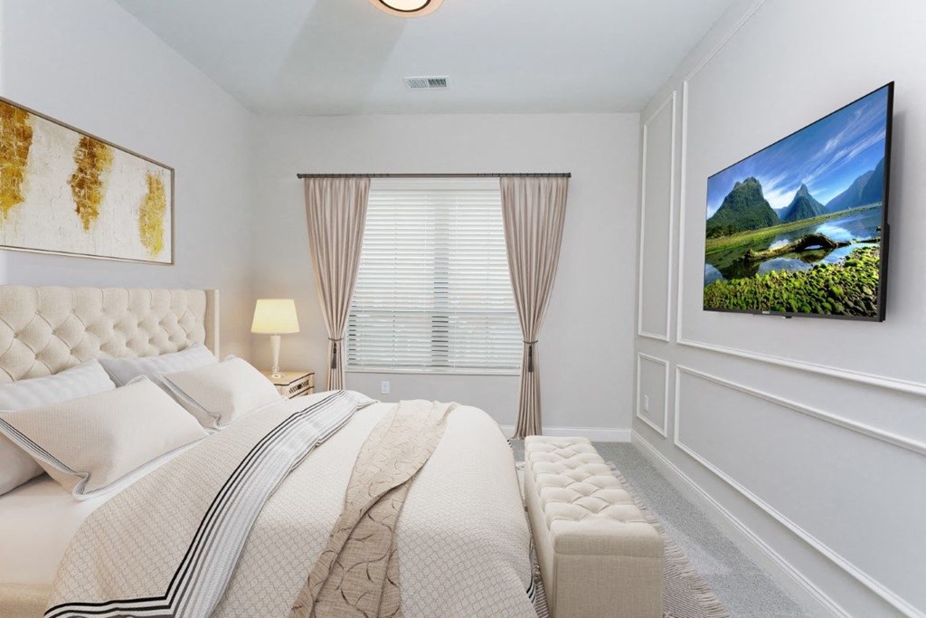 a bedroom with a large bed and a large window at Fairfax, Grandview, OH