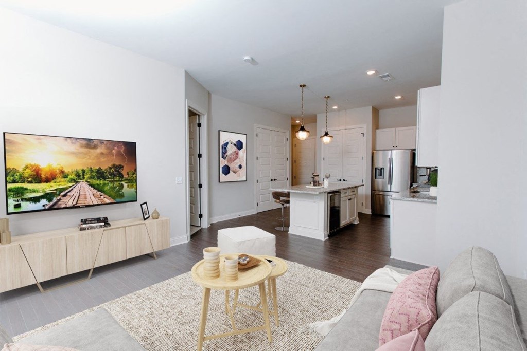 a living room with a couch and a coffee table in front of a tv at Fairfax, Grandview, 43212