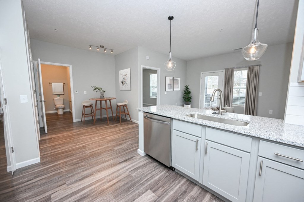 a kitchen and living room with a sink and a counter top at Elan Park, Columbus, OH 43231