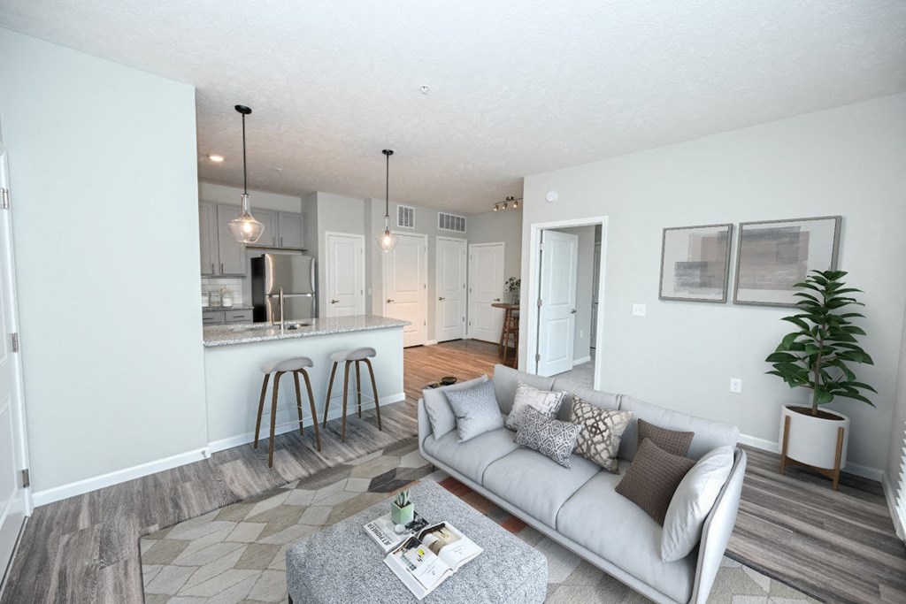 a living room and kitchen with a couch and a table at Elan Park, Ohio