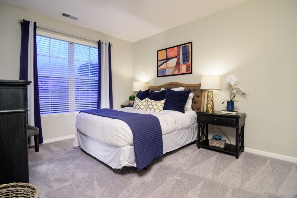 a bedroom with a large window and a bed at Elan Park, Columbus