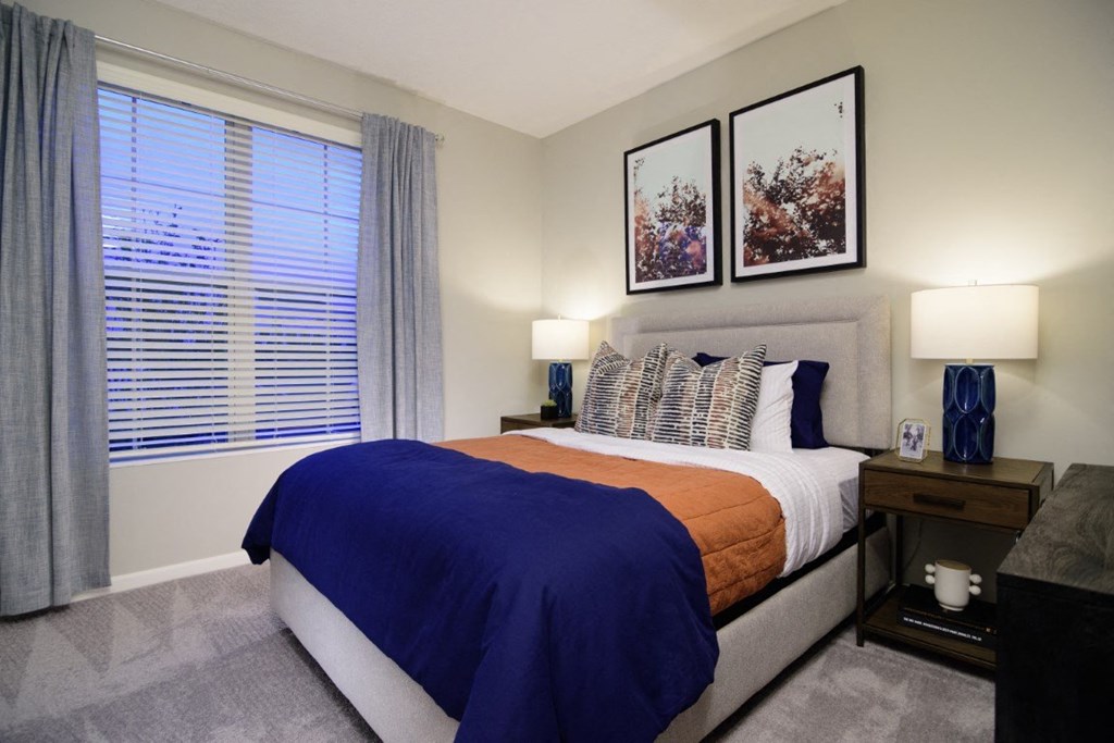 a bedroom with a bed and a large window at Elan Park, Columbus, OH 43231