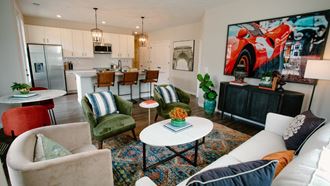 a living room with couches and chairs and a kitchen in the background at Dalton, Ohio, 43081