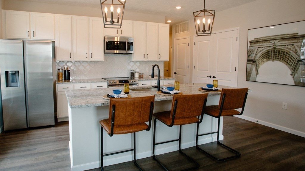 a kitchen with white cabinets and a marble counter top at Dalton, Ohio, 43081