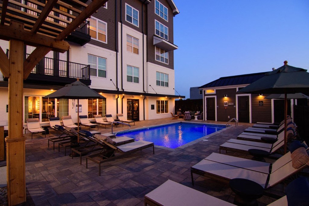 a swimming pool in the backyard of a house with lounge chairs at Kendall Park, Columbus, OH