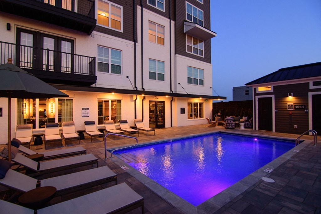 a swimming pool with a blue light on the side of a building at Kendall Park, Ohio