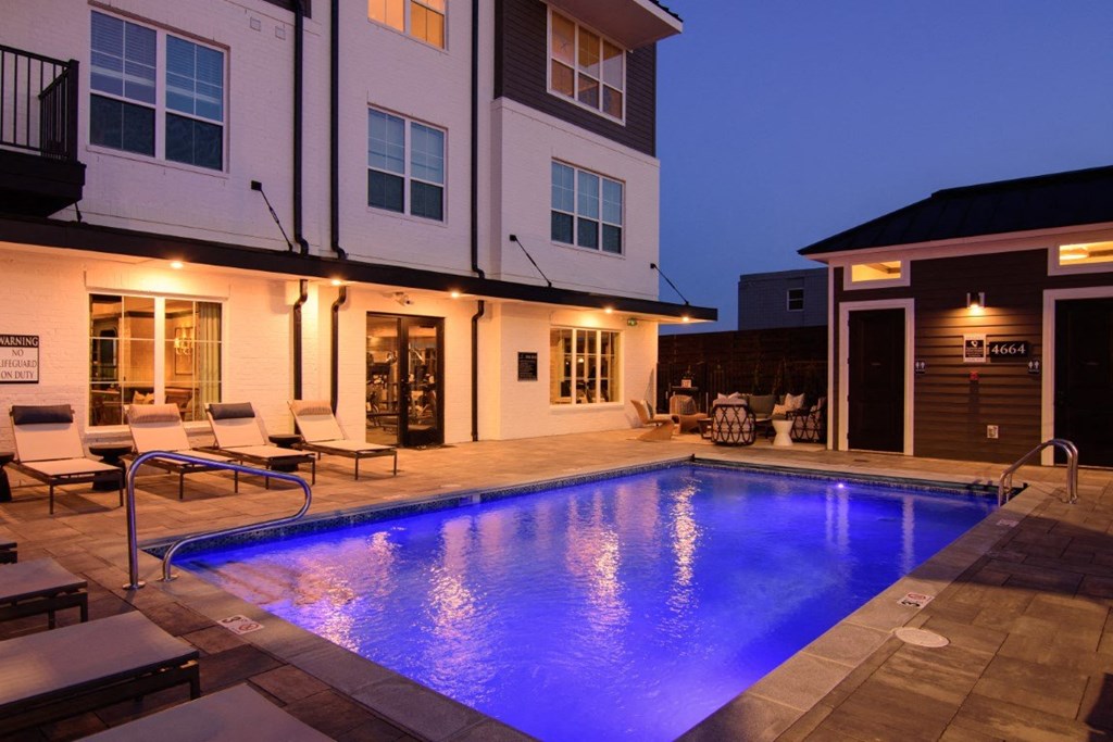 the pool is lit up at night in the backyard of a house at Kendall Park, Ohio, 43220