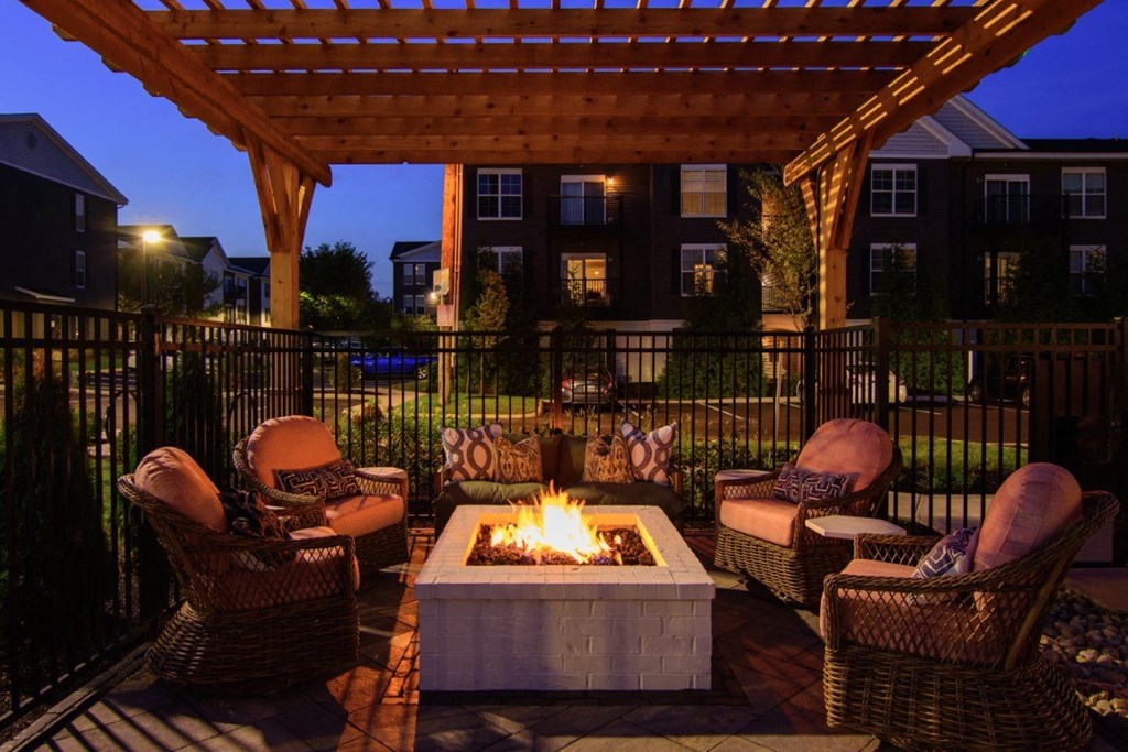 a patio with chairs and a fire pit at Kendall Park Too, Columbus, OH 43220
