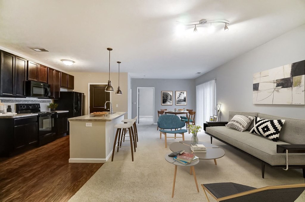 a living room with a couch and a kitchenat Taylor House Apartments, Ohio, 43214