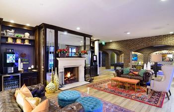 a living room filled with furniture and a fire placeat Madison Park Apartments, Ohio