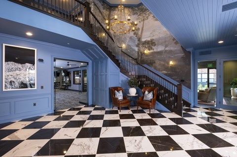 A black and white checkered floor in a spacious room.