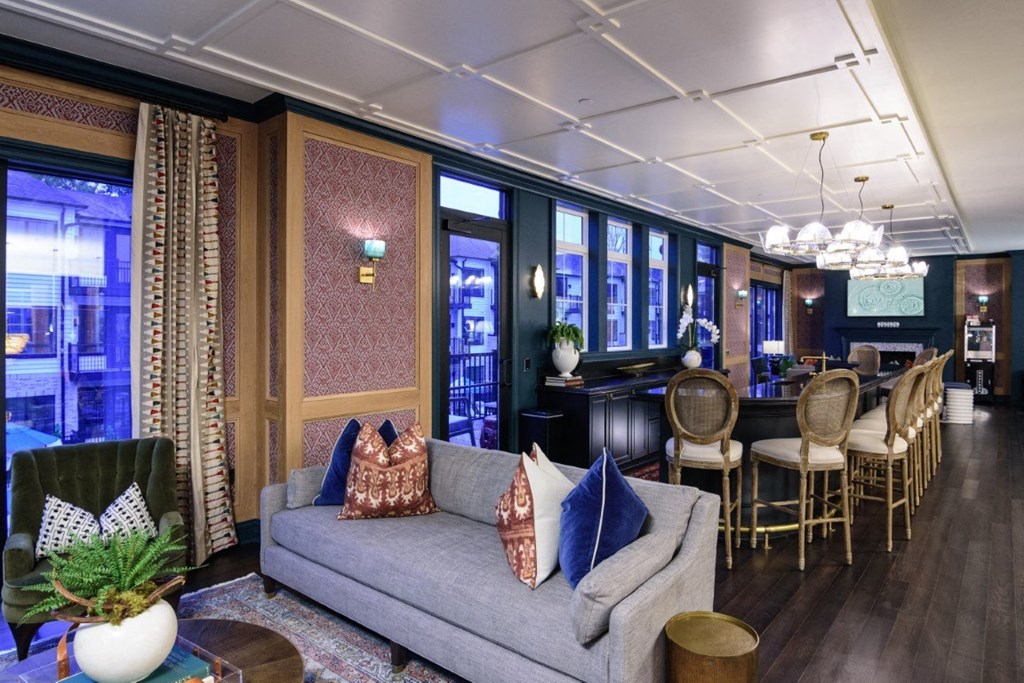 a living room with a couch and chairs and a bar at Dalton, Ohio