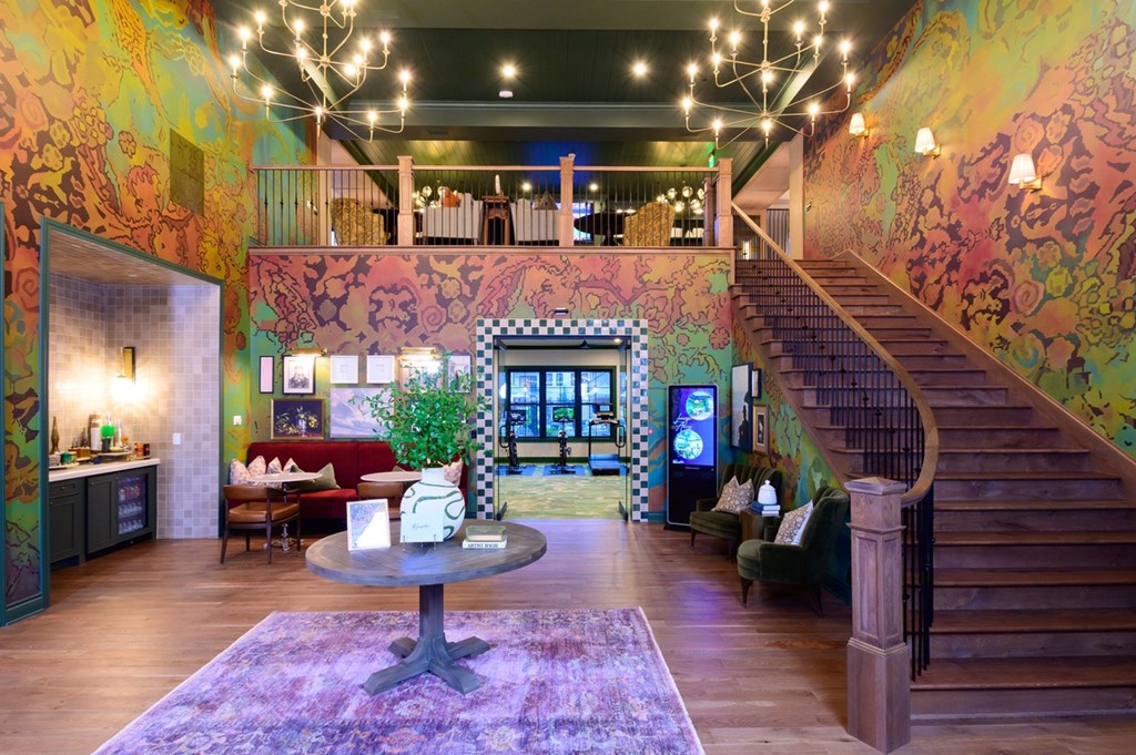 A living room with a staircase and a couch.