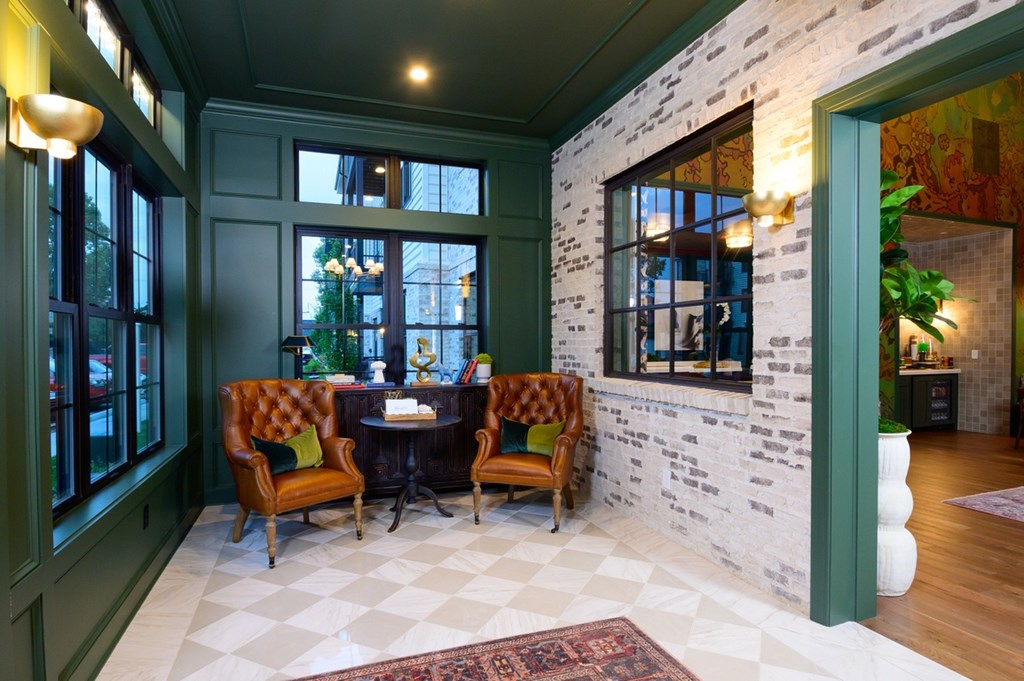 A room with a table and chairs in the middle of it.