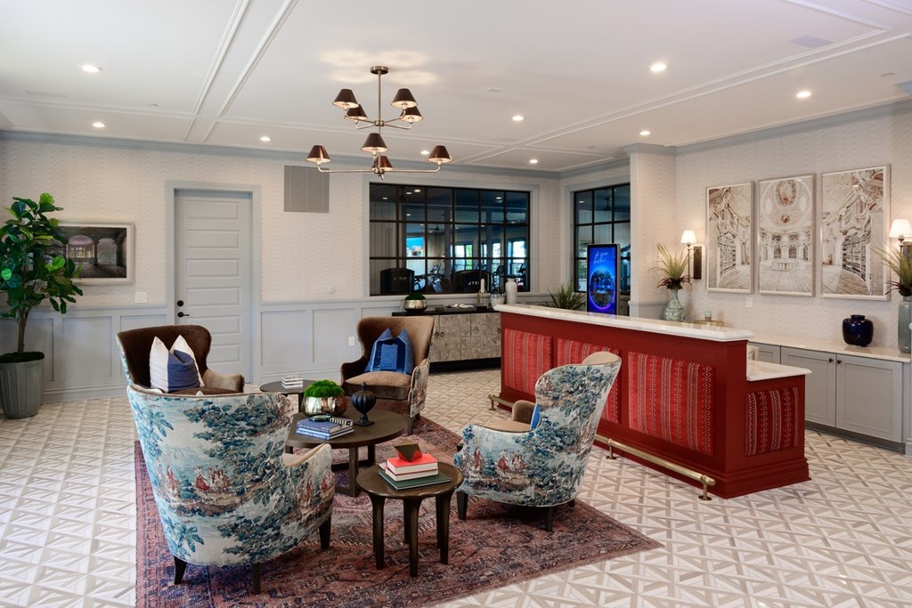 A living room with a white ceiling and a rug on the floor.
