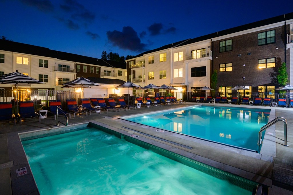 A swimming pool in a resort at night.