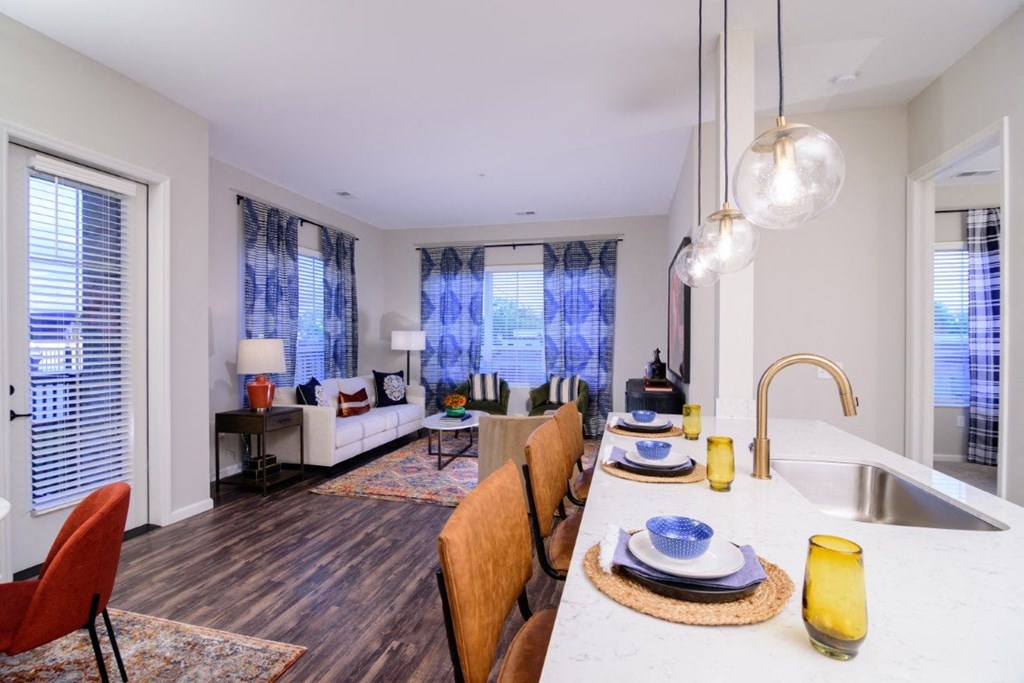 a kitchen and living room with a large table and a sink at Essex, Columbus, 43212