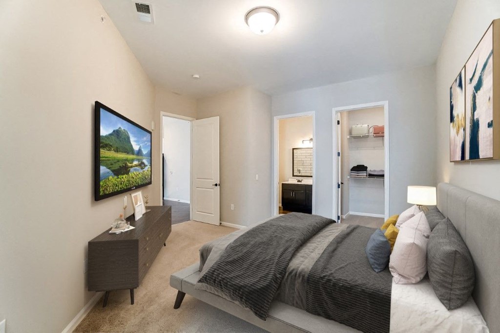 a master bedroom with a bed and a closet at Essex, Columbus, Ohio, 43212
